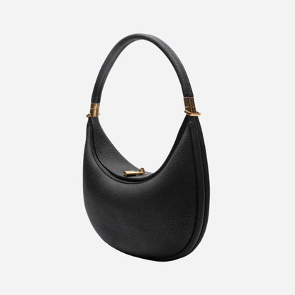 Black Luna  handbag with gold accents on a white background