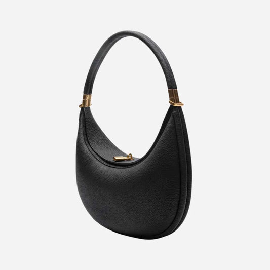 Black Luna  handbag with gold accents on a white background