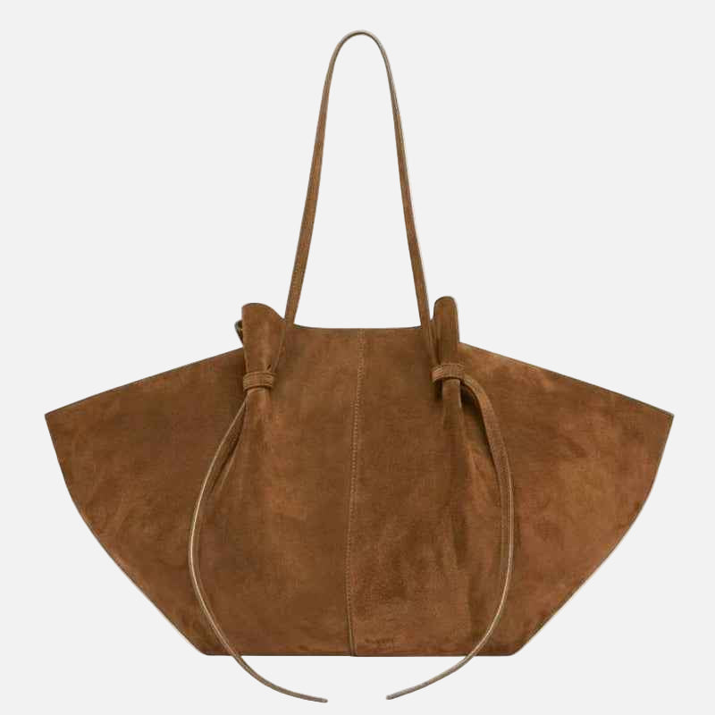 Brown suede handbag with a strap on a white background