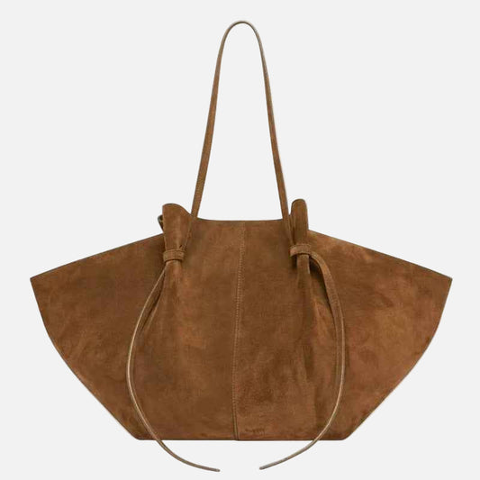 Brown suede handbag with a strap on a white background